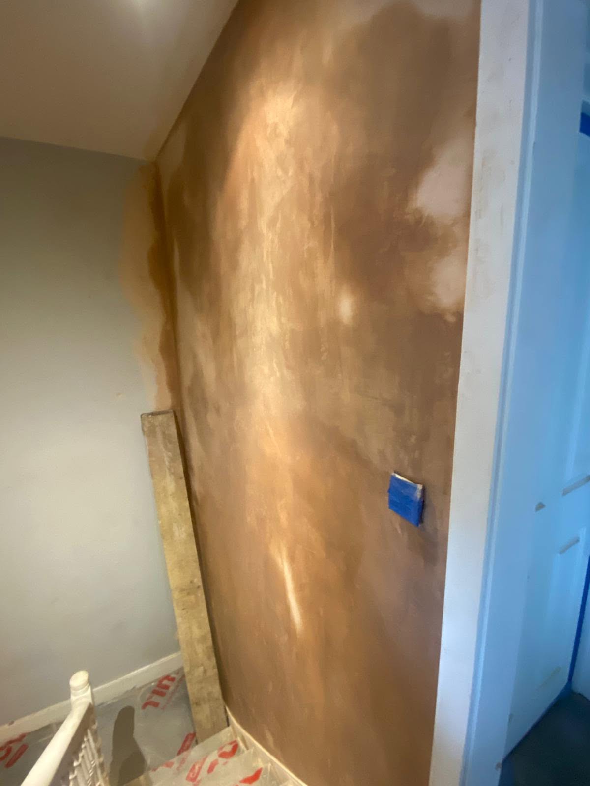 Wall skimmed smooth and finished after plastering