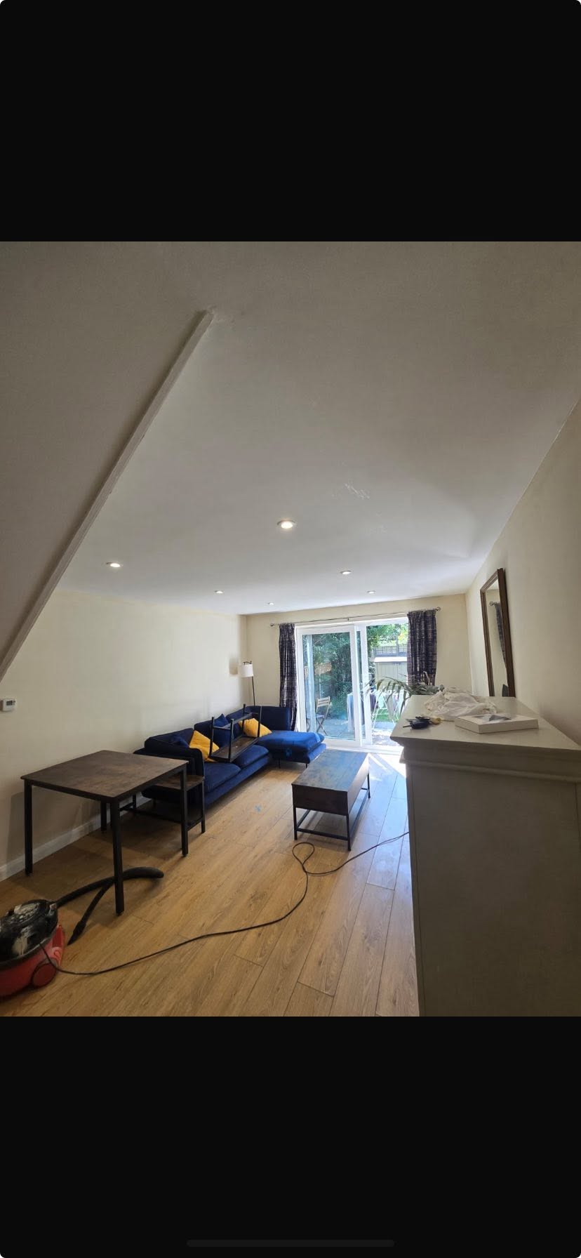 Finished living space with pitched plastered ceiling, ready to decorate