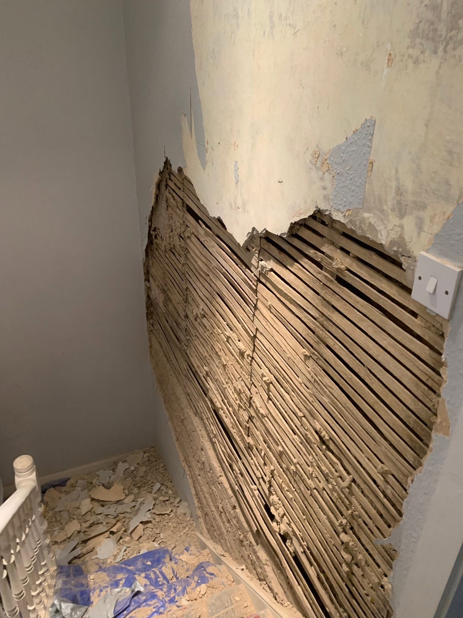 Original lath and plaster wall stripped back before repair